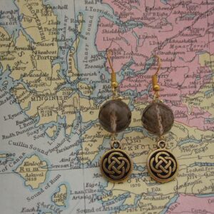 Drop Earrings with Smokey Quartz and gold plated celtic knotwork charms. Designed and created in the Isle of Skye
