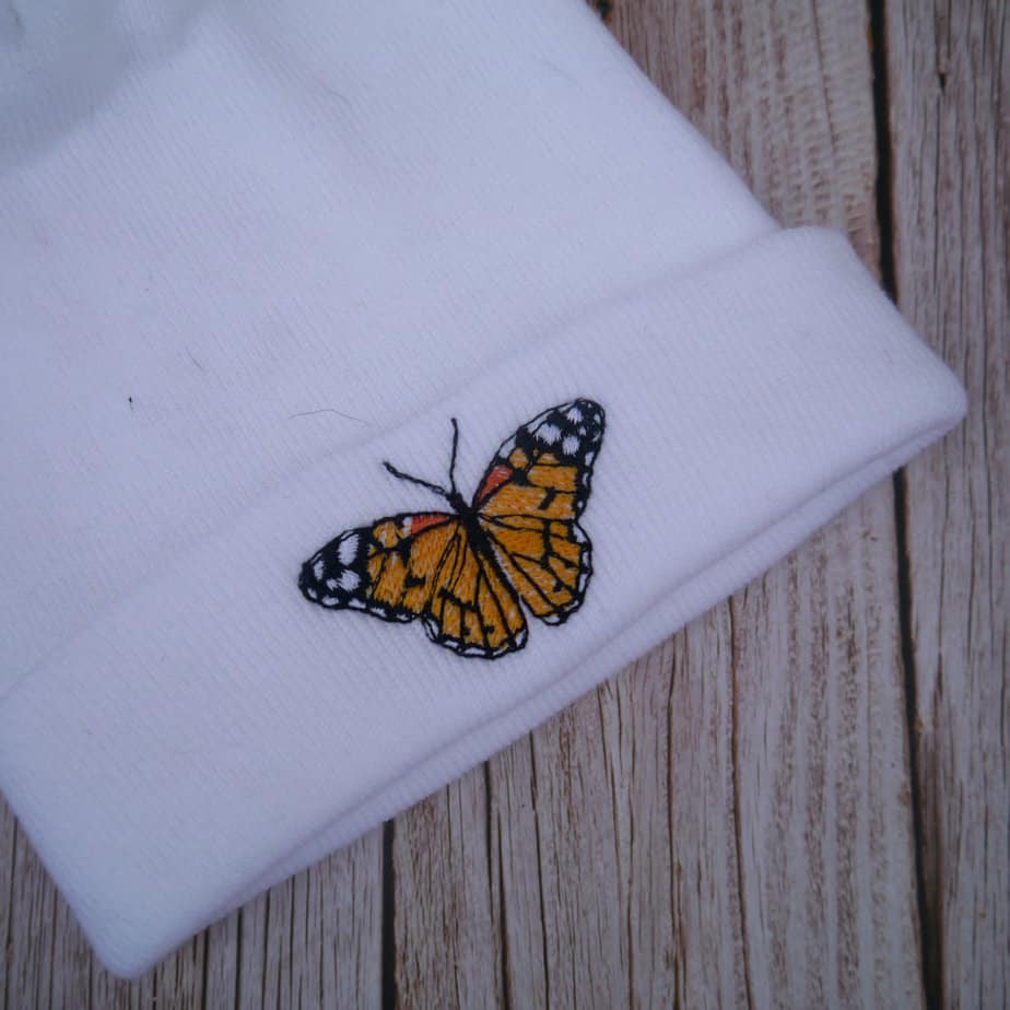Lovely Butterfly Embroidered Beanie With Bobble - Image 1
