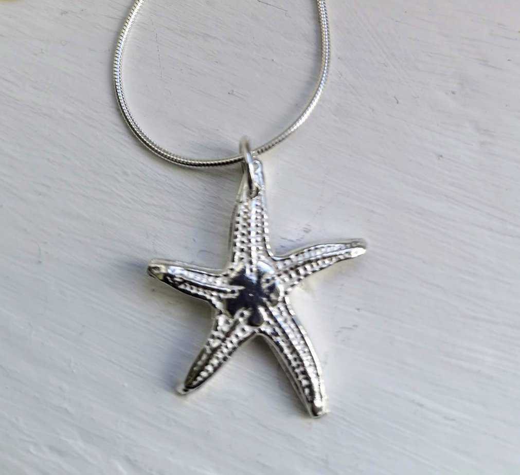 Tiree Solid Silver Starfish Pendant on a silver snake chain - Image 1