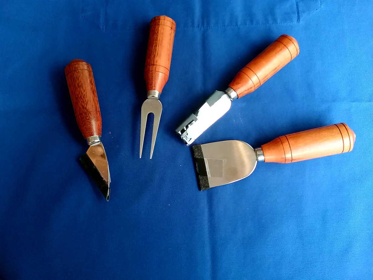 Set of four stainless steel cheese knives with hand-turned Scottish hardwood handles by The Bute Woodspoiler in the Isle of Bute