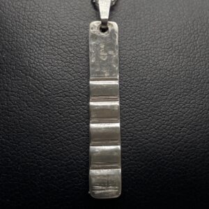 Silver pendant corrugated and hammered finish
