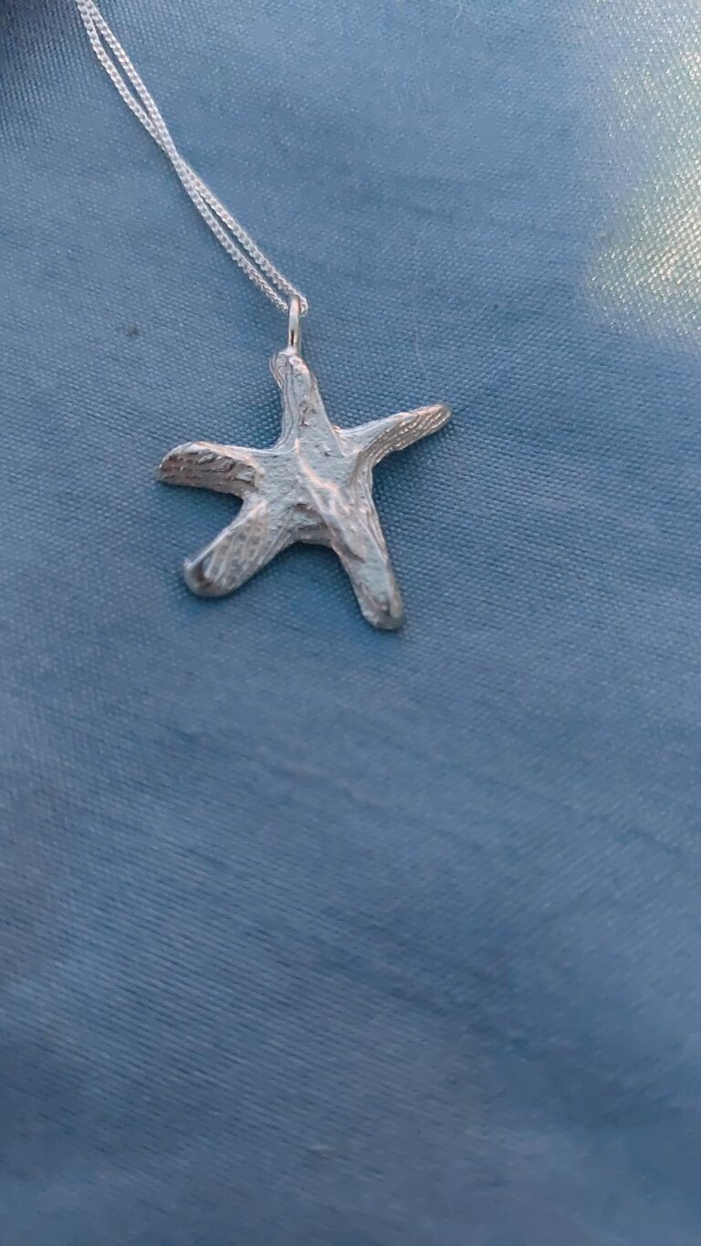 Silver star fish cast in cuttle fish bone - handmade by Designs on Benbecula