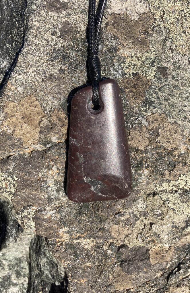 purple-brown stone pendant