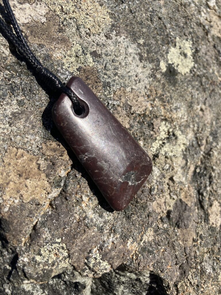 purple-brown stone pendant