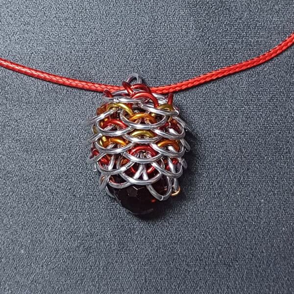 Fire dragon egg pendant - handmade by Manatee Maille