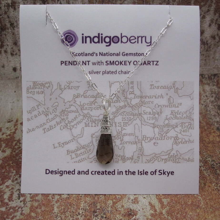 Smokey quartz pendant with silver plated celtic style bead cap and silver plated chain.