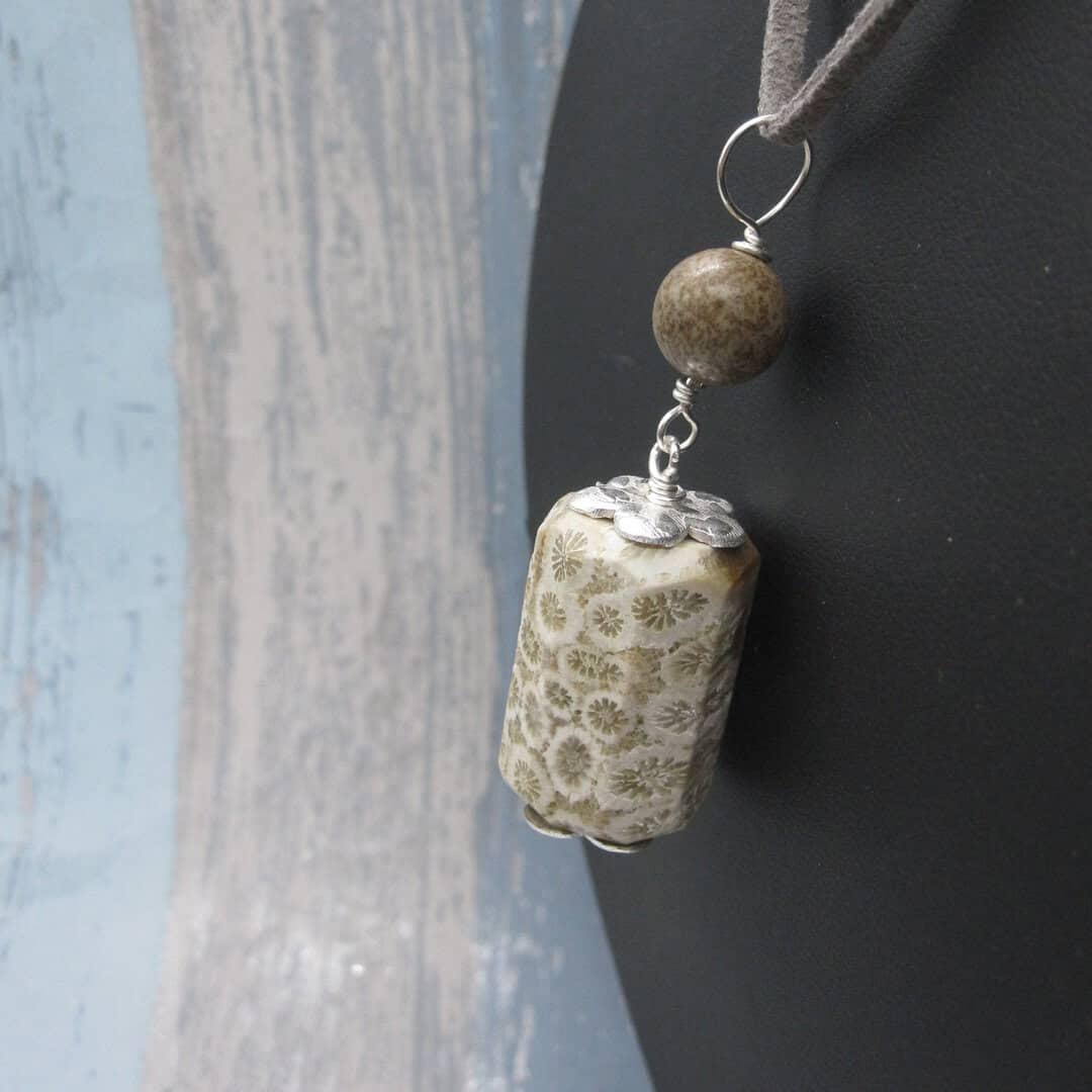 Fossil jasper pendant with simple silver plated bead caps and a single focal bead of deep brown jasper on a grey leather cord. Designed and created in the Isle of Skye.