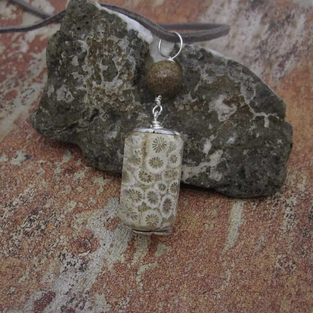 Fossil jasper pendant with simple silver plated bead caps and a single focal bead of deep brown jasper on a grey leather cord. Designed and created in the Isle of Skye.