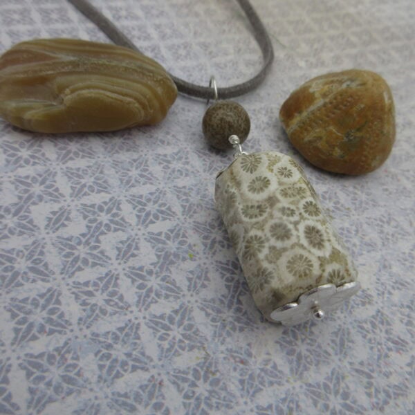 Fossil jasper pendant with simple silver plated bead caps and a single focal bead of deep brown jasper on a grey leather cord. Designed and created in the Isle of Skye.