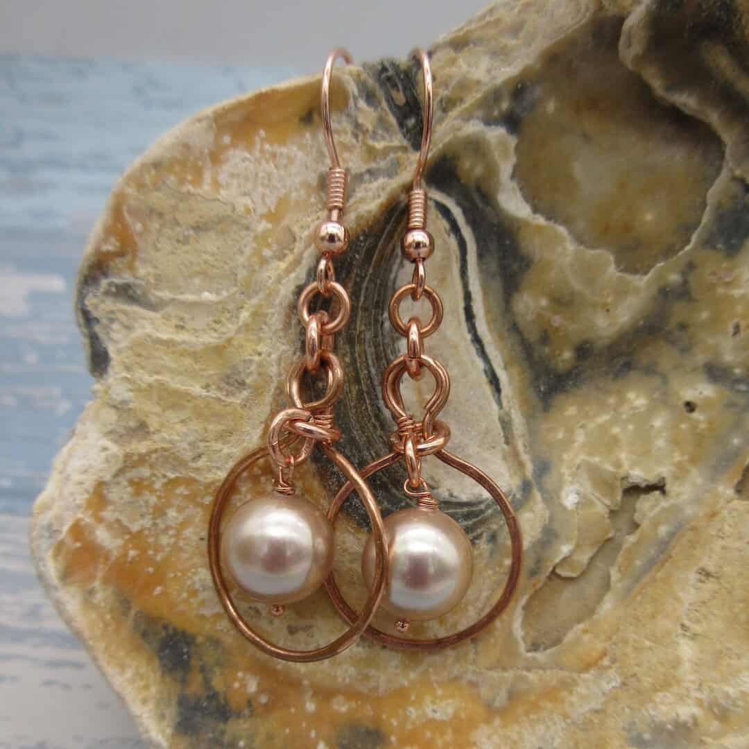 One of a kind shell pearl drop earrings with rose gold plated wire detail and shepherd hooks.