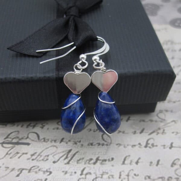 Earrings with silver plated heart and lapis lazuli.