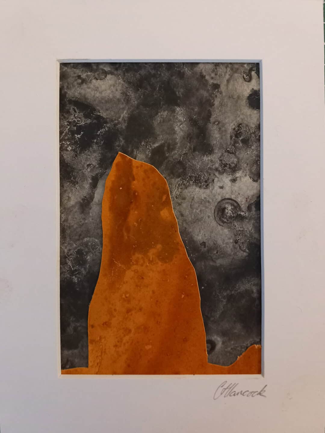 Old Man of Storr with Rust stained stone and seaweed pressed dark sky
