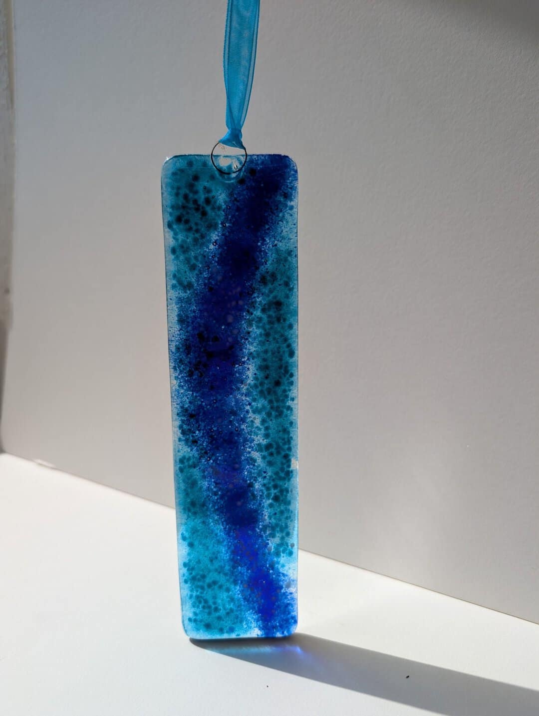 Wave fused glass long hanging hand made by Flow Glass Orkney Islands Scotland