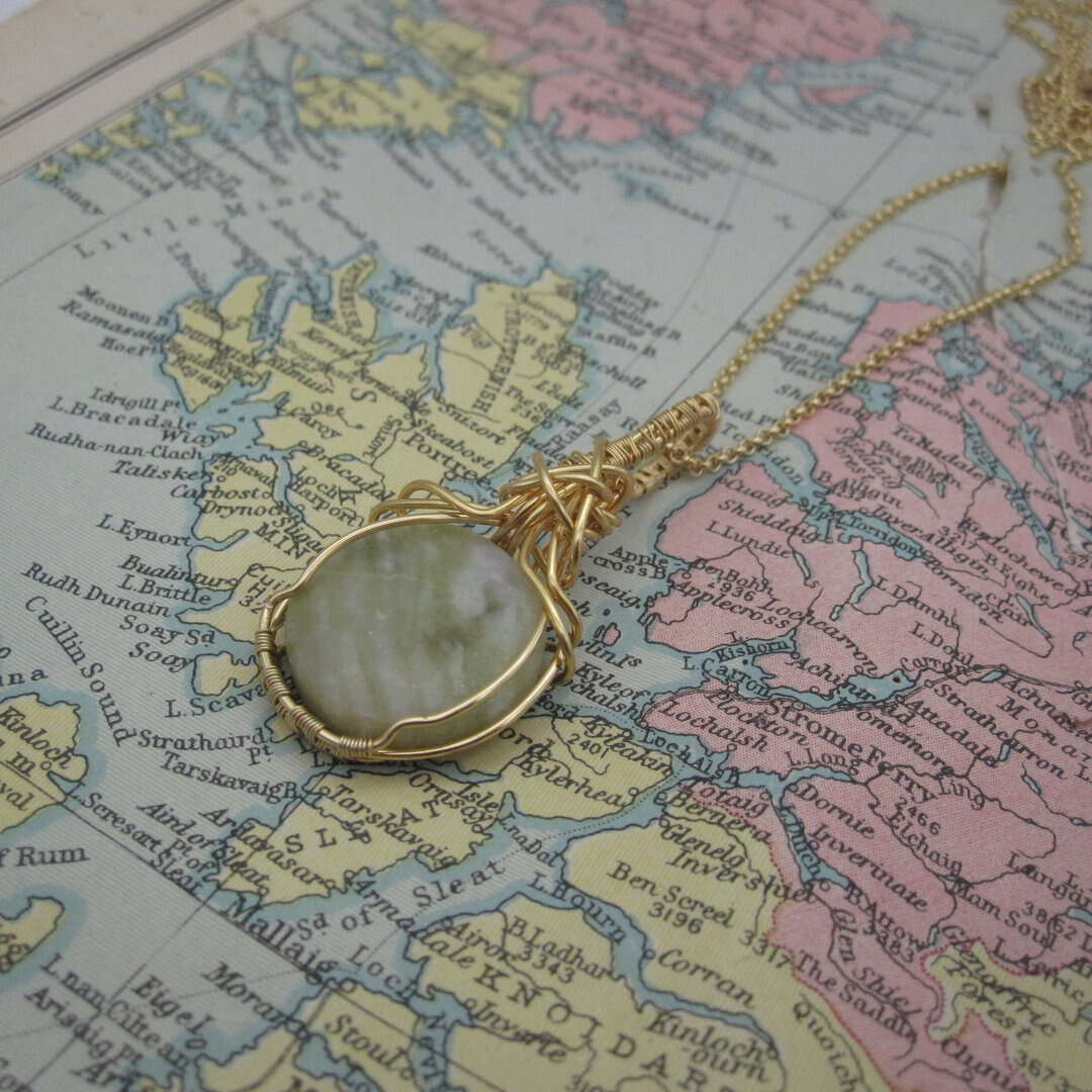 circular skye marble pendant with gold plated wire wrap and chain. Designed and created in the Isle of Skye by Indigo Berry.